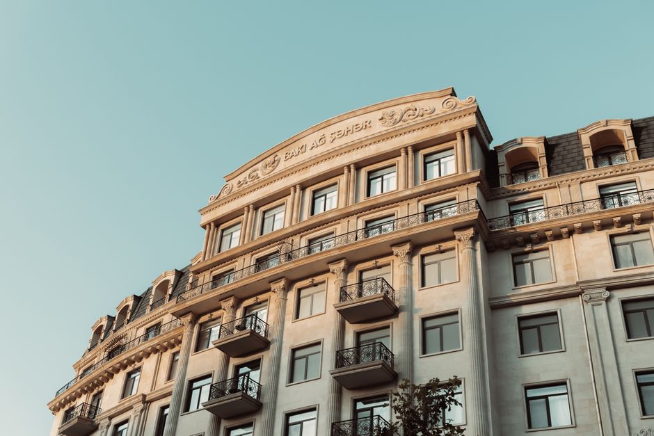 Ornate building facade in Baku, featuring classic design under a clear sky.
