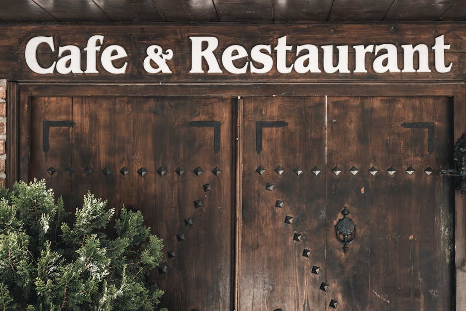 Wooden entrance of a cafe and restaurant in Amasya with rustic signage.