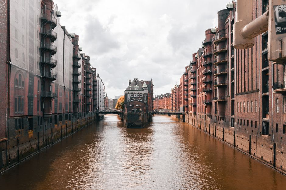 View of the iconic Speicherstadt warehouse district in Hamburg, Germany, along a scenic canal.