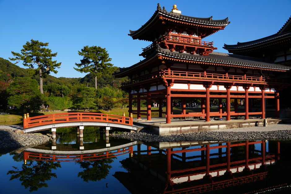 Stunning view of Byodo-In Temple in Uji, Kyoto with perfect reflection in pond.