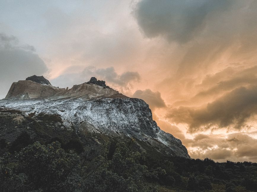 Beautiful sunset over rugged Patagonian mountains with stunning clouds in Chile.
